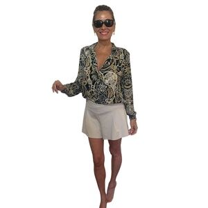 Ladies gold and black polyester button down top. Long sleeves.